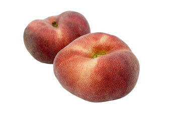Two flat or fig peaches isolated on white background