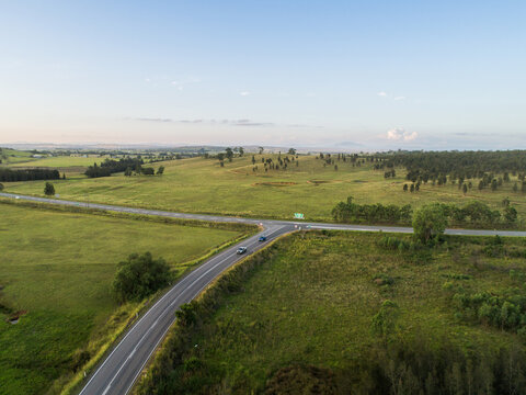 Aerial view of t intersection with cars turning off main road &ndash; Golden Highway