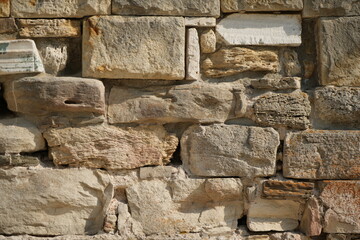 ancient wall made of shell limestone ancient wall built from shell limestone (rakushnyak) blocks. natural porous texture typical for historical Mediterranean and Eastern European architecture. ideal 