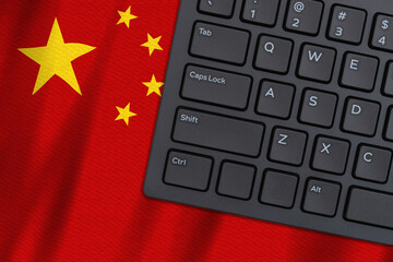 Computer keyboard on a Chinese flag