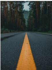 Illustration of an empty asphalt road with a bright yellow line disappearing into a misty treelined forest