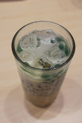 Traditional Indonesian Iced Cendol Drink with Coconut Milk and Palm Sugar