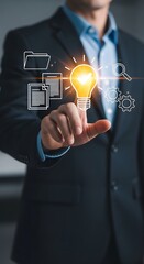 Professional businessman uses futuristic interface to access innovative ideas and manage data with digital icons for strategy and planning