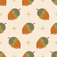 Cute seamless pattern with hazelnut and green stars on pastel beige background in polka dot order.