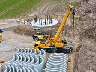Beginning of tower construction for a wind turbine: aerial view, construction site, wind turbine, energy transition, tower, prefabricated parts, hybrid tower, concrete parts