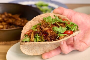Crispy Pulled Lion's Mane Mushroom Pita - Hand Held