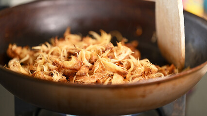 Warming Pulled Shredded Lion's Mane Mushroom in Frying Pan