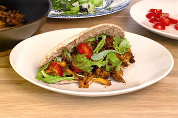 Crispy Pulled Lion's Mane Mushroom Pita on White Plate