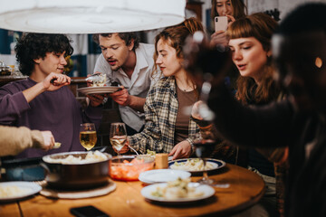 Friends enjoy a home-cooked meal together, sharing laughter and moments around the table at night.