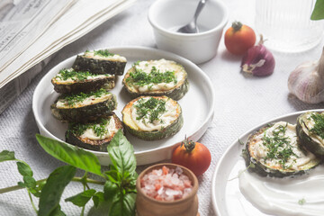 Appetizing Fried zucchini with garlic sauce in a white plate