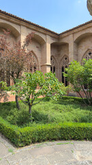 Exploring the tranquil courtyard of Catedral de Siguenza in Spain during a sunny afternoon