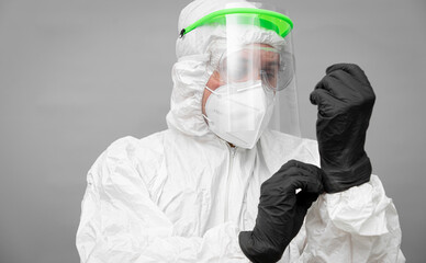 Nurse prepares for patient care wearing protective gear during the Covid19 pandemic in a clinical...