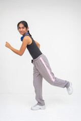 An athletic Young Asian Transwoman in mid-run pose with a forward arm and back foot raised....
