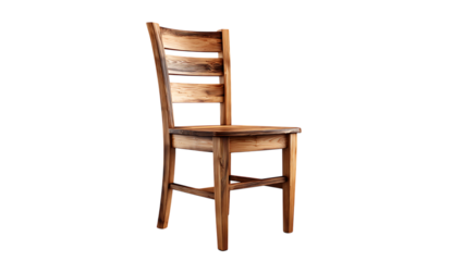 A single wooden chair with a ladder back design isolated against a black background in a studio shot
