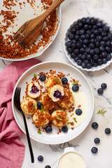 Blueberry curd dumplings with butter and cinnamon crumbs..top veiw.style hugge