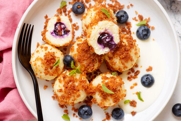 Blueberry curd dumplings with butter and cinnamon crumbs..top veiw.style hugge