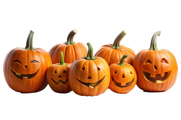 A group of six carved pumpkins with glowing faces, ready for halloween night isolated on transparent background