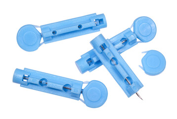 Disposable lancets draw blood for testing on white background