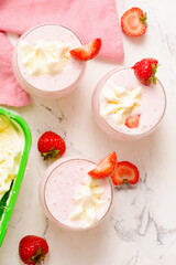 homemade strawberry milkshake with ice cream