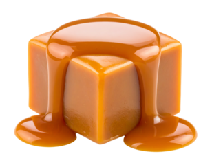 One beautiful sweet caramel candy cube topped with caramel sauce isolated on white background