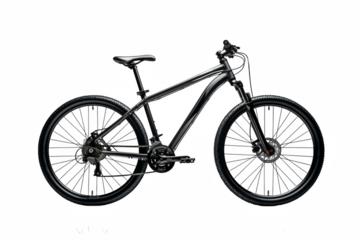 An elegant dark mountain bike stands out with its sleek design against a stark black backdrop, showing cycling adventure.
