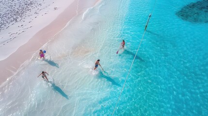 Aerial view of people enjoying the turquoise water and white sand beach on a sunny day vacation spot