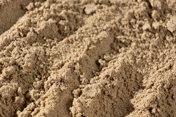 Ground Flax Flour Close-Up. Natural Brown Superfood Background.