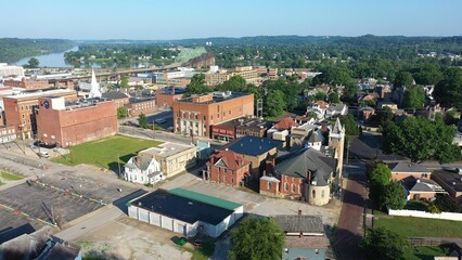 Parkersburg, WV, showcases historic buildings, lush parks, and the winding Ohio River, blending natural beauty with urban charm in a stunning panorama.