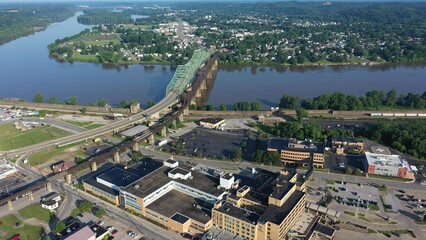Panoramic aerial view of Parkersburg, West Virginia, featuring the Ohio River, Little Kanawha, and downtown buildings amidst lush Appalachian landscape.
