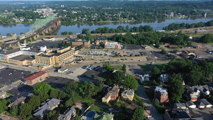 Explore the vibrant downtown of Parkersburg, West Virginia, nestled along the Ohio River, surrounded by lush greenery and historic architecture.