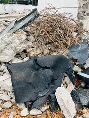 Mountain full of metal waste, concrete, etc. on a construction site