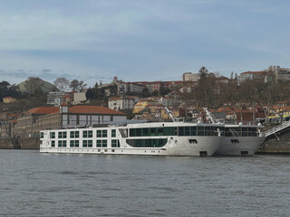 Luxury river cruiseship cruise ship liners docked at pier getting ready for Douro summer Portugal...