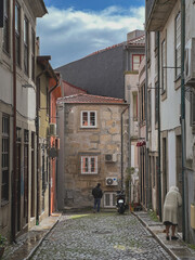Romantic backstreet, side street or alley in historic old town of Porto Oporto, Portugal with...