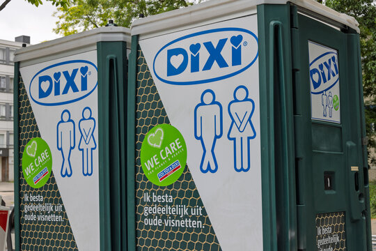 Two portable toilets, branded "DIXI," are shown outdoors. They feature large blue and green logos with male and female figures and text in Dutch promoting sustainability.