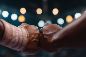 Boxers bumping fists before start of match