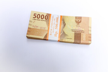 Stacked Indonesian Rupiah Banknotes On White Background