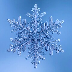 Intricate Snowflake Crystal on Blue Background Captured in Macro Photography