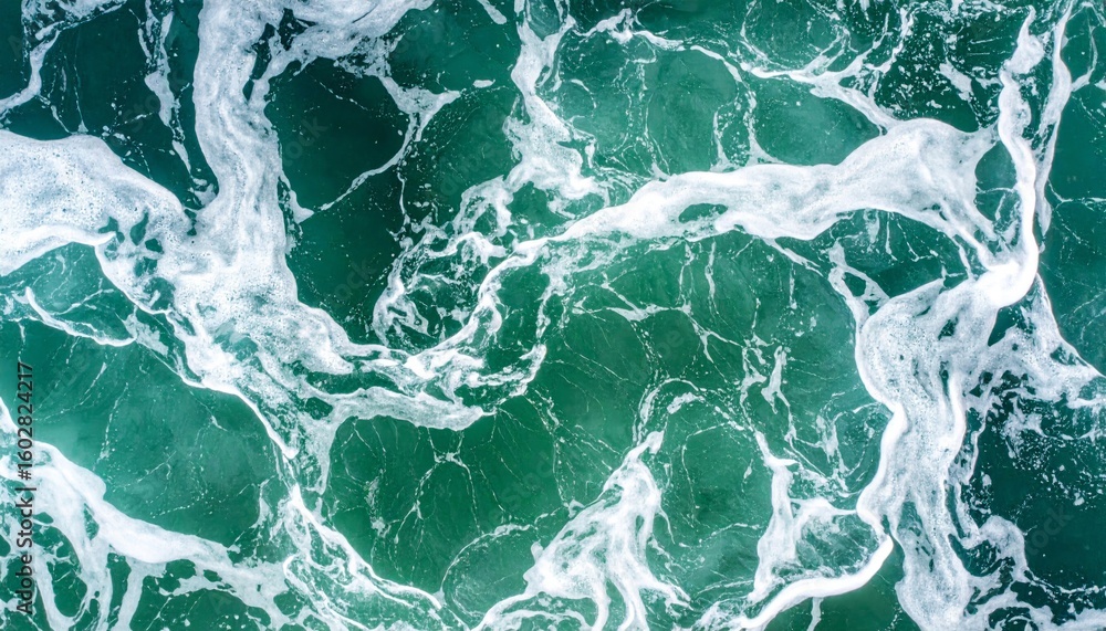 Poster aerial view of emerald ocean waves with white foam creating abstract pattern