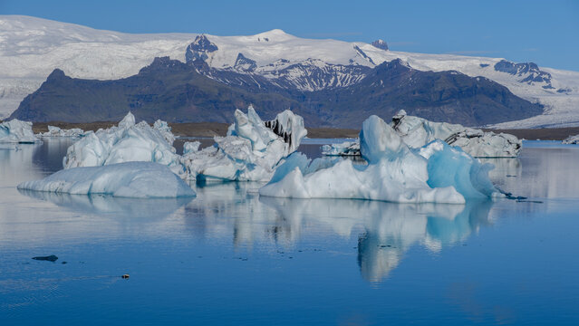 Discover breathtaking icebergs and serene waters at Jokulsarlon Glacier Lagoon in Iceland
