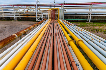 Steel long pipes and pipe elbows inthe  station oil factory during refinery valve of visual check record pipeline tank oil