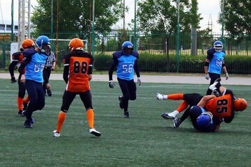American football players fighting for the ball	

