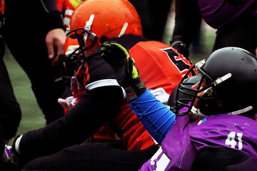 Close-up american football players fighting for the ball	
