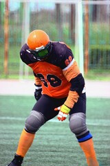 American football player watching the ball	
