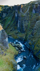 Exploring the majestic landscapes of Icelands dramatic canyons and turquoise rivers