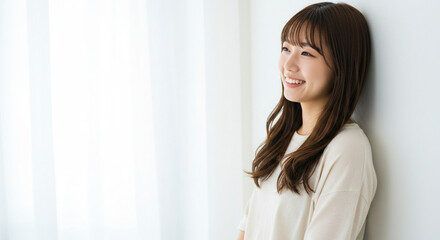 Natural Beauty of Young Asian Woman Smiling in Bright Minimalist Space