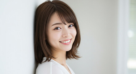 Natural Beauty of Young Asian Woman Smiling in Bright Minimalist Space