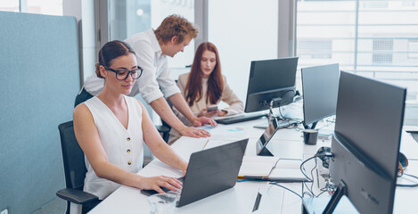 Collaborative Office Teamwork in a Modern Workspace for Enhanced Productivity and Success