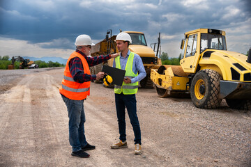 Highway engineers discuss and plan.