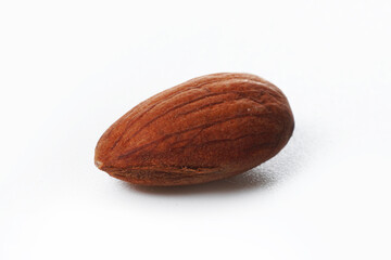 A single unit almond nut on pure white background.                         