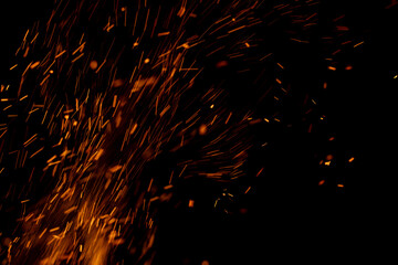 A black background with a lot of orange sparks